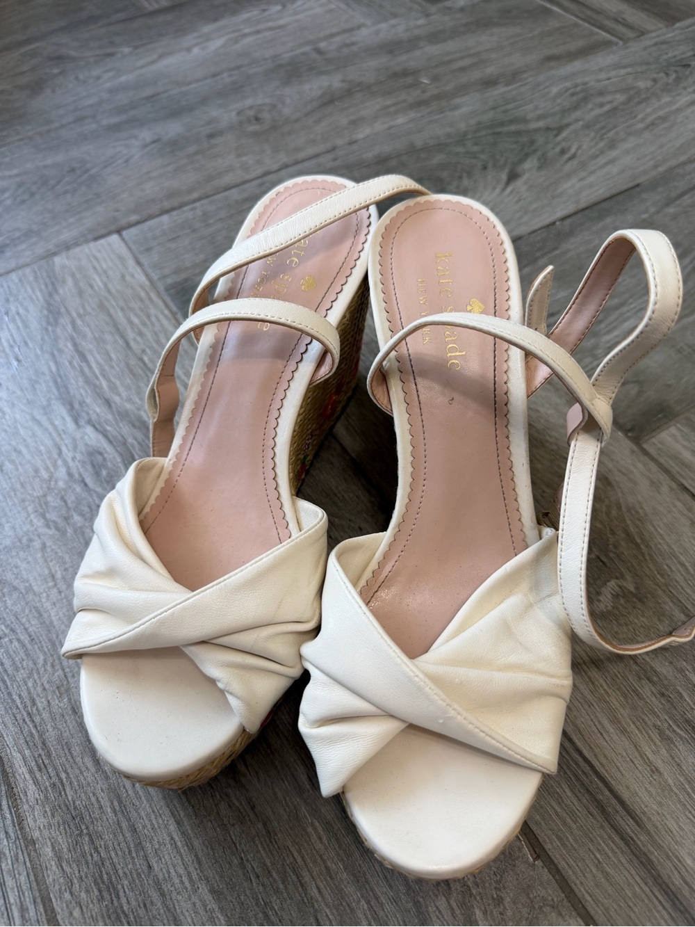 kate spade Ivory Leather Twisted Front Wedge Sandals